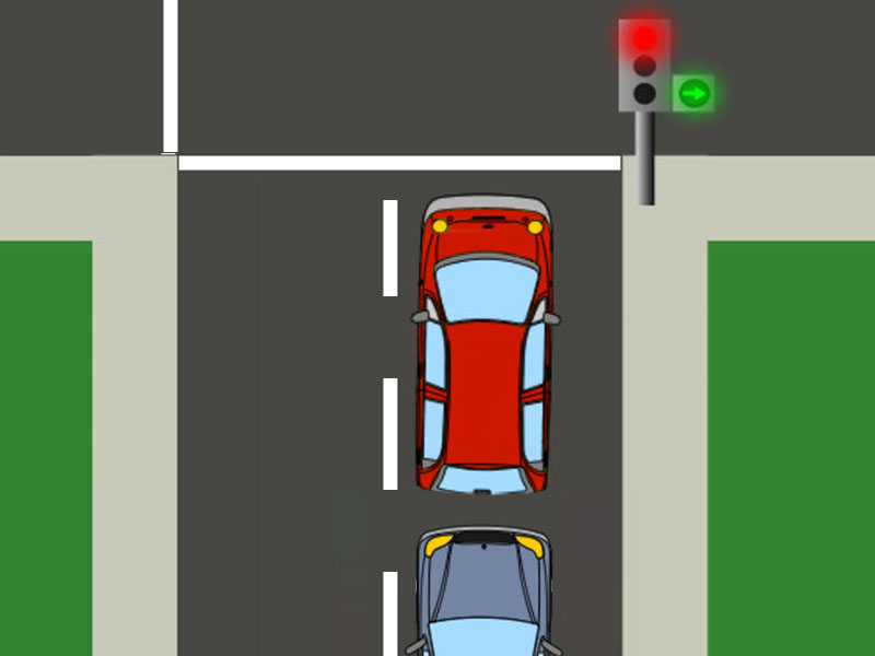The driver of the red vehicle intends to go straight, but the auxiliary traffic light shows a green right-turn arrow…