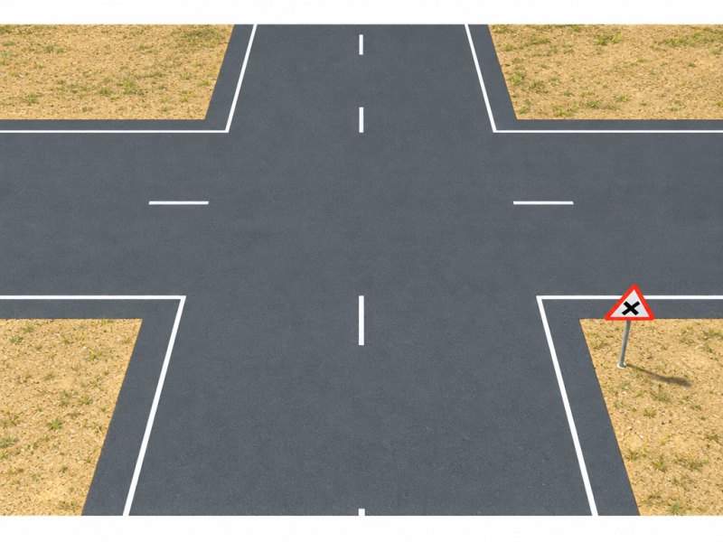 When turning left at this intersection, where should the centre of the intersection be in relation to your vehicle?